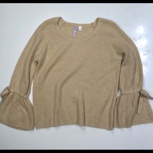 Tan sweater with tied sleeves